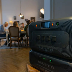 Bluetti portable power stations in a cozy home with family dining in background
