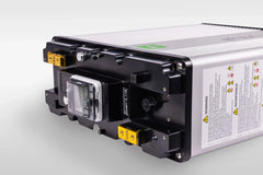 Inverter unit with warning label, control panel, ports, and silver-black casing on white background