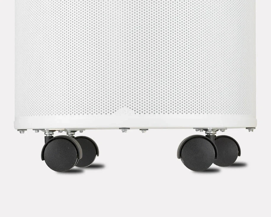 Set of four black caster wheels attached to a white perforated appliance base