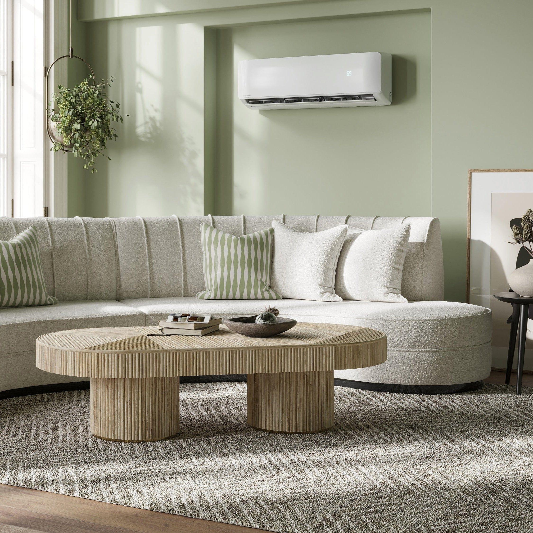 MRCOOL wall-mounted air conditioner in a modern living room with white sofa and wooden table