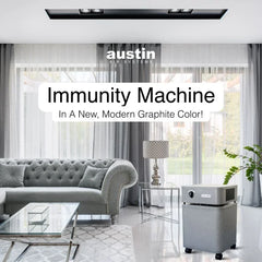 Austin Air graphite gray air purifier with 8-phase filter in modern living room