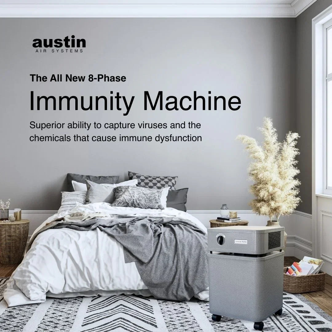 Austin Air Immunity Machine air purifier in stylish bedroom setting, virus filter appliance