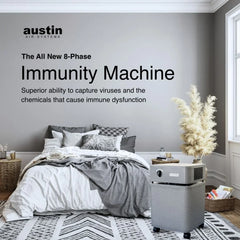 Austin Air Immunity Machine air purifier in stylish bedroom setting, virus filter appliance