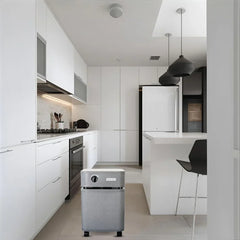 Austin Air air purifier in modern white kitchen, home appliance on wheels under pendant lights