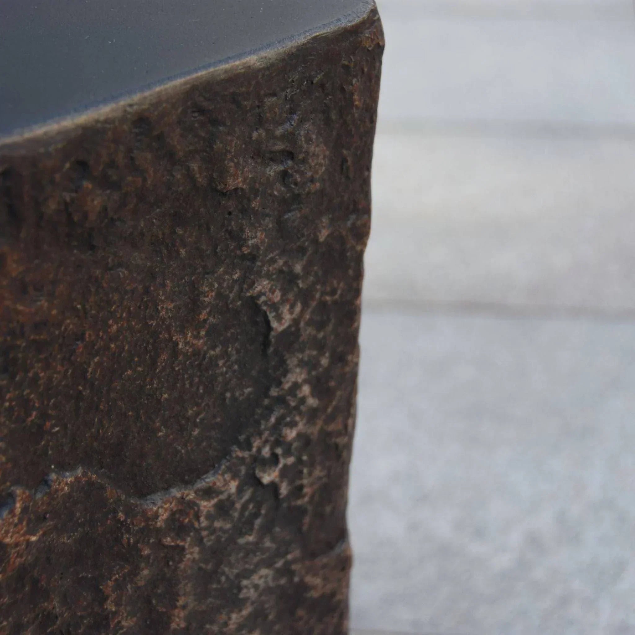 Elementi Columbia Seat textured brown stone accessory close-up on outdoor surface