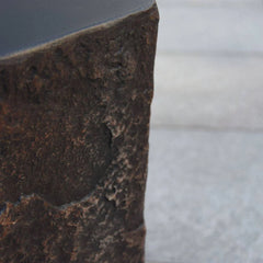 Elementi Columbia Seat textured brown stone accessory close-up on outdoor surface