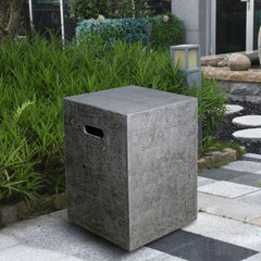 Elementi Manhattan or Hampton tank cover on modern outdoor patio with greenery