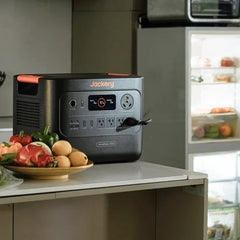 Jackery HomePower 3000 portable power station on kitchen counter with appliances and vegetables