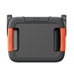 Jackery portable power station with two orange handles, top view, black and gray casing