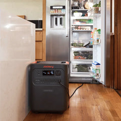 Jackery HomePower 3600 Plus portable power station in kitchen powering refrigerator