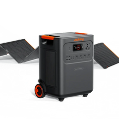 Jackery portable power station with digital display, wheels, and solar panels in background