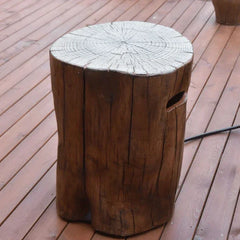 Manchester cast concrete tank cover in redwood finish with gas hose set up on a wooden deck
