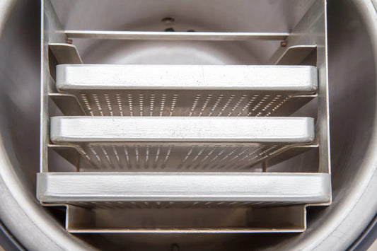 Stainless steel freeze dryer trays with perforated surfaces in industrial dryer