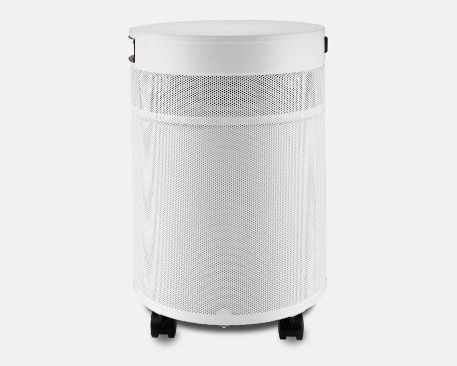 White cylindrical air purifier with mesh exterior and caster wheels on the bottom