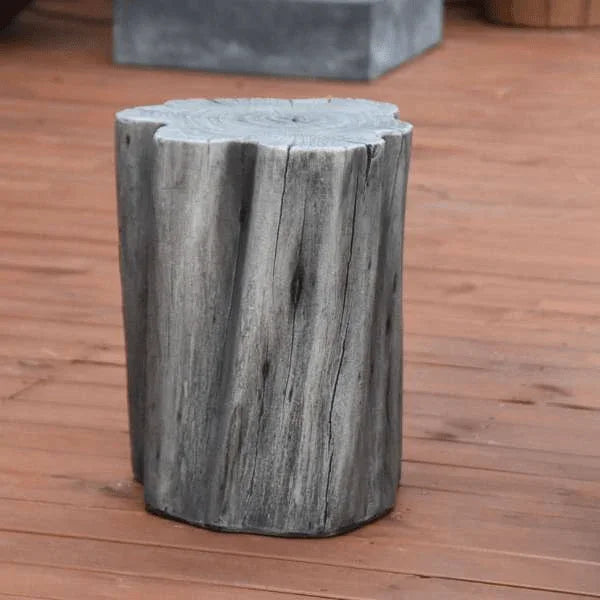 Elementi Warren seat classic grey, log-shaped outdoor stool on wooden deck