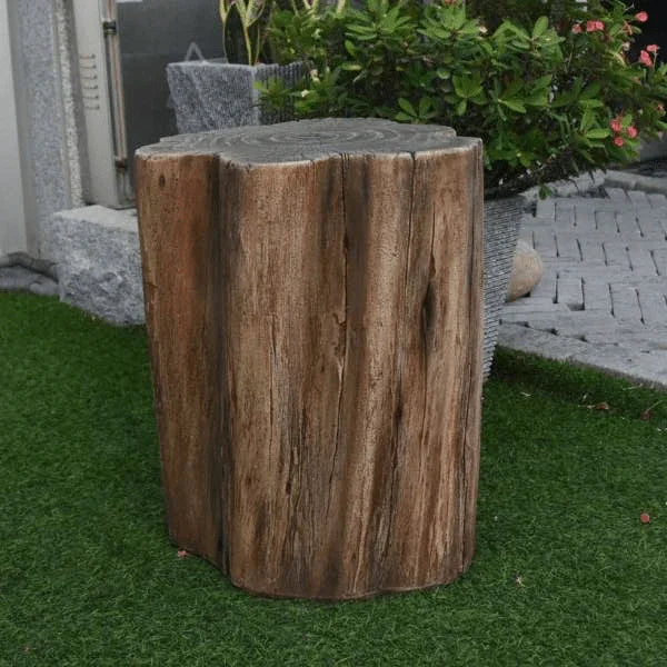 Elementi Warren seat in redwood finish set on artificial grass with lush garden plants