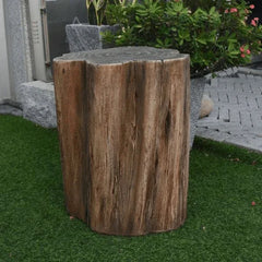 Elementi Warren seat in redwood finish set on artificial grass with lush garden plants