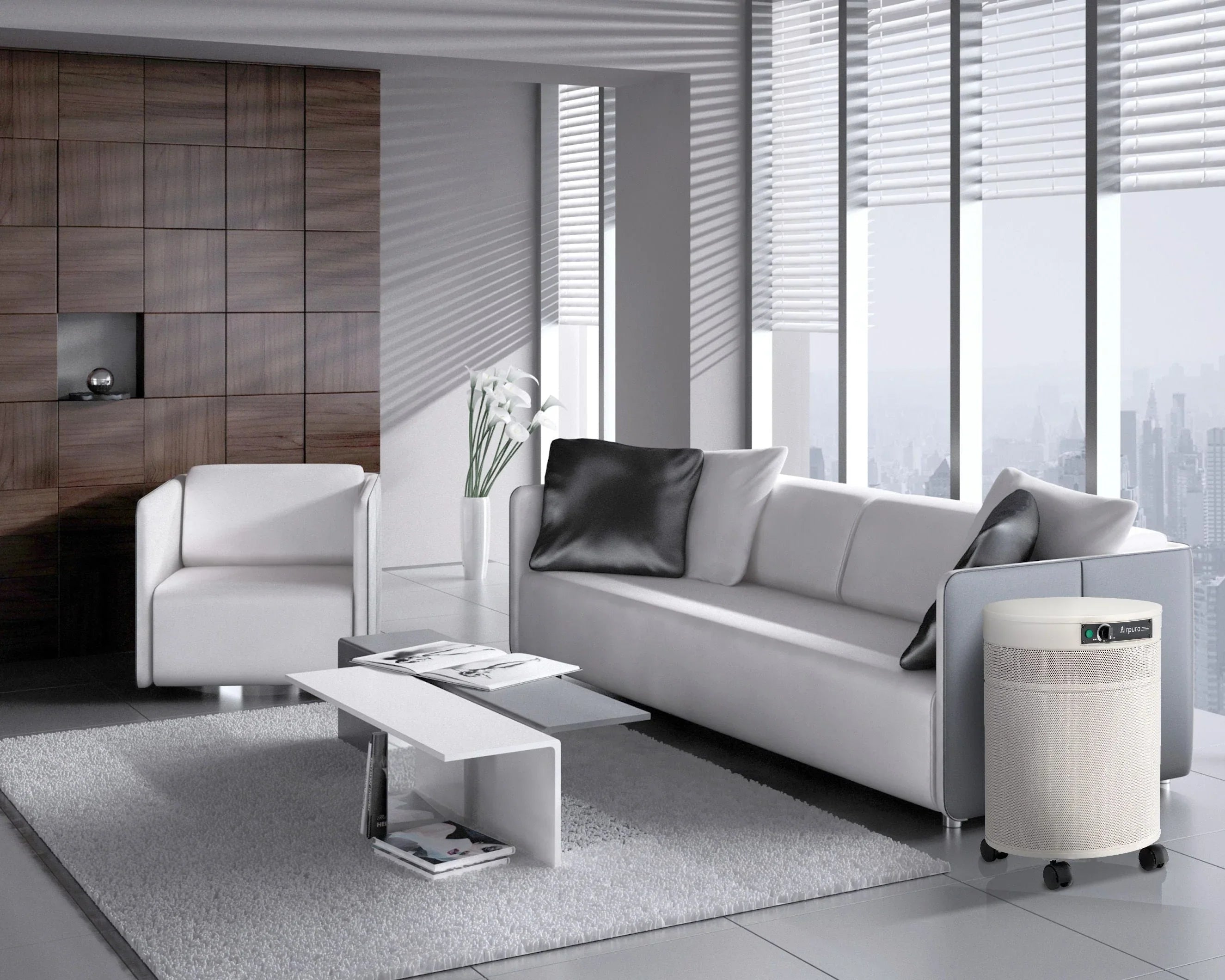 Airpura air purifier in modern living room with white sofa, armchair, and city view windows