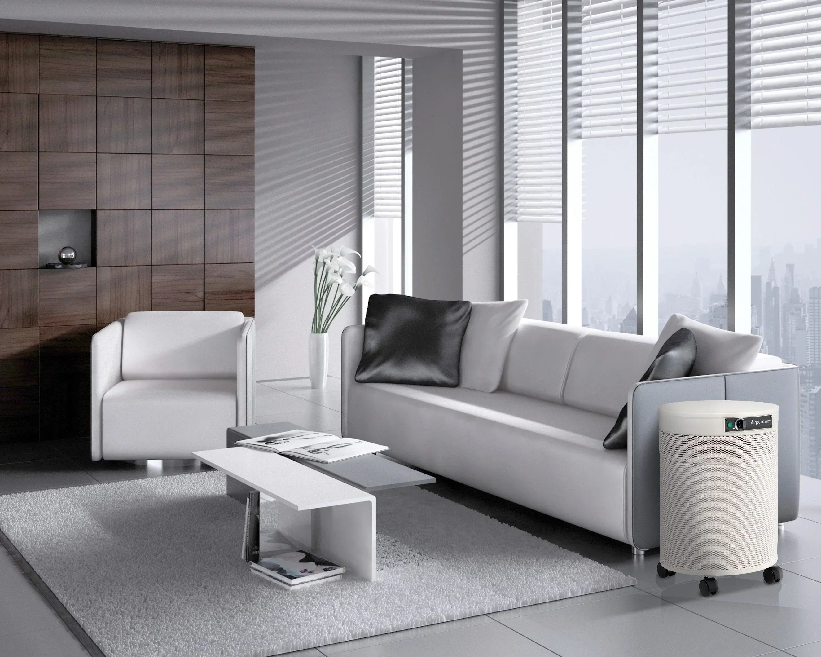 Airpura air purifier in a modern living room with white sofa, armchair, and city view